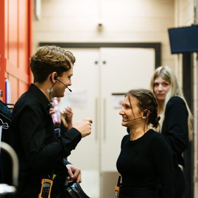 Stage Managers chatting backstage